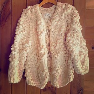 Soft and beautiful white Pom Pom sweater.